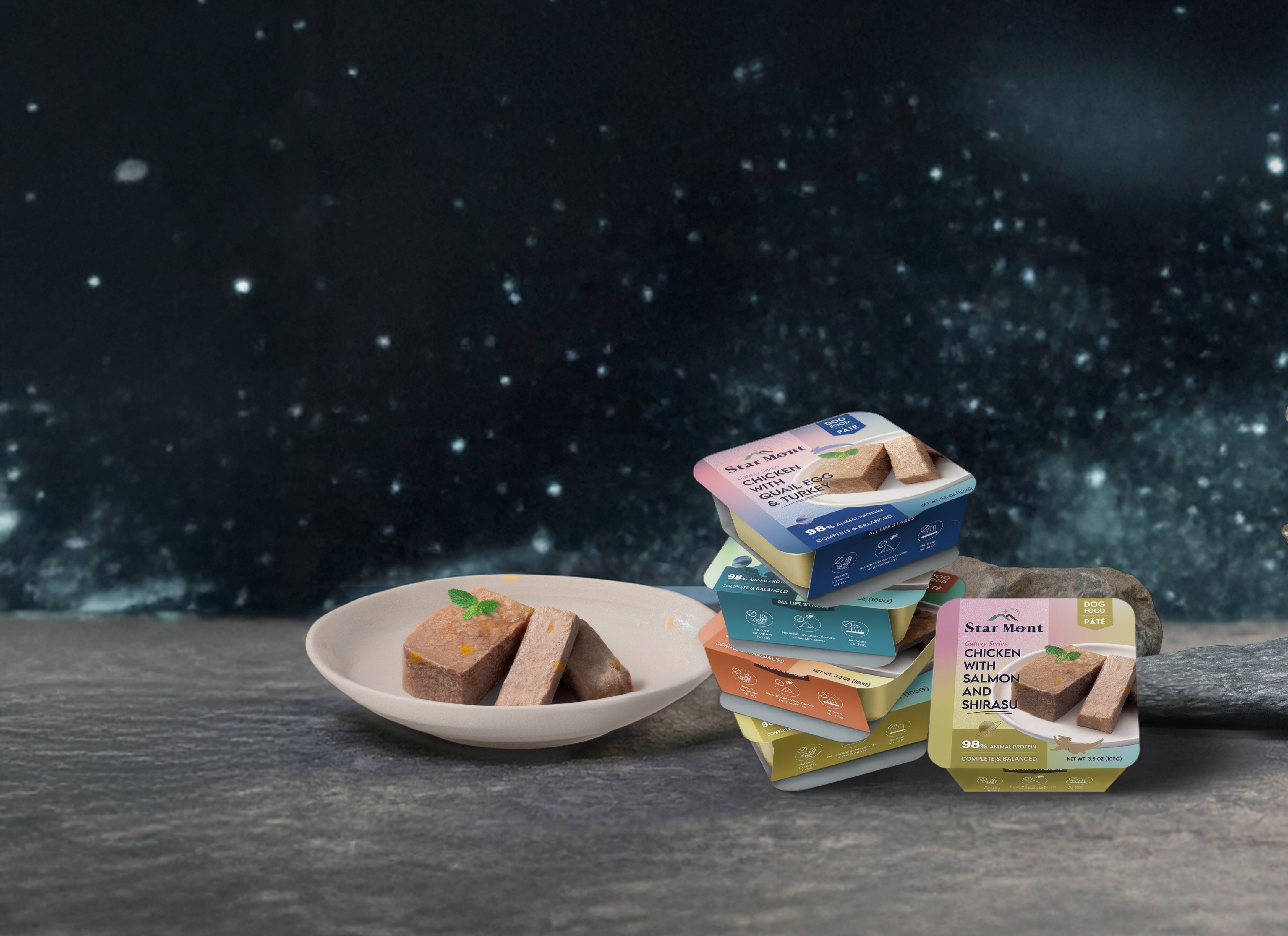 Packets of pet food on a plate with a dark space-themed background